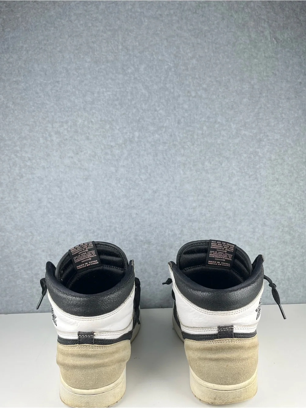 Nike Black and White High-Top Sneakers with Pink Logo